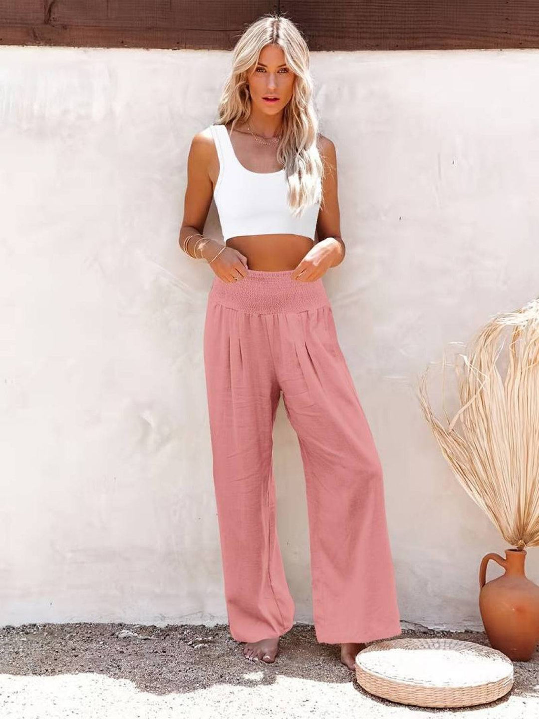 Black high waist smocked wide leg trousers, flowy and versatile for women.