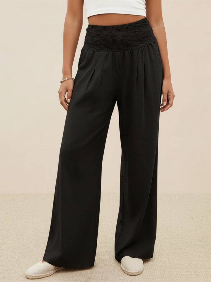 Versatile black wide leg palazzo pants with smocked high waist for women.