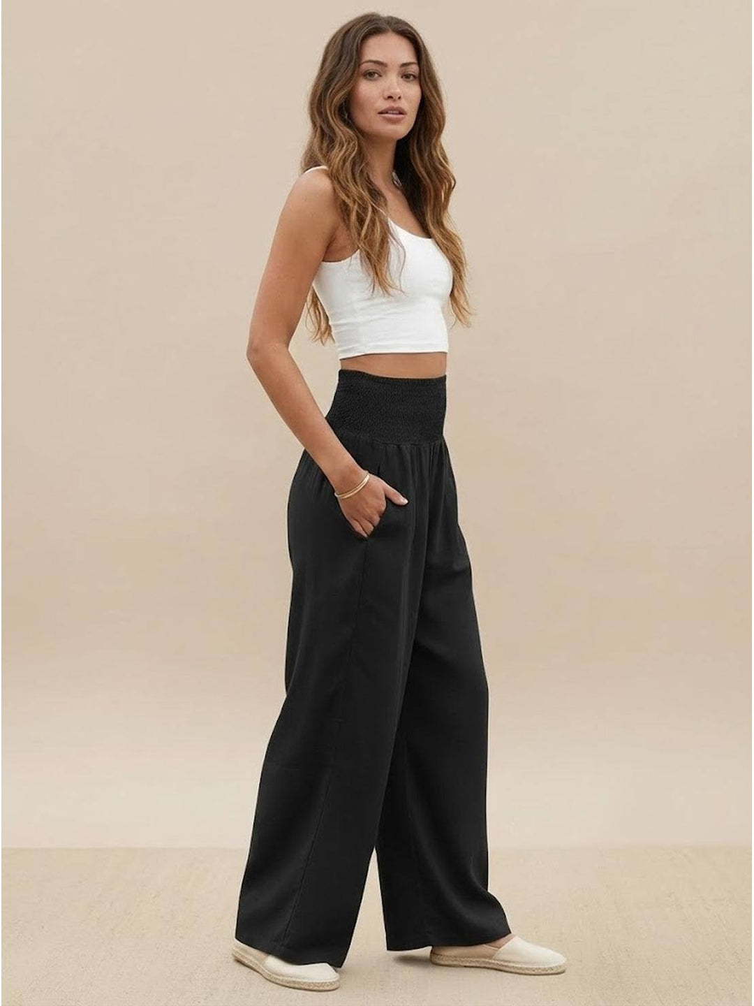Chic navy women's high waist smocked wide leg palazzo pants, elegant & flowy.