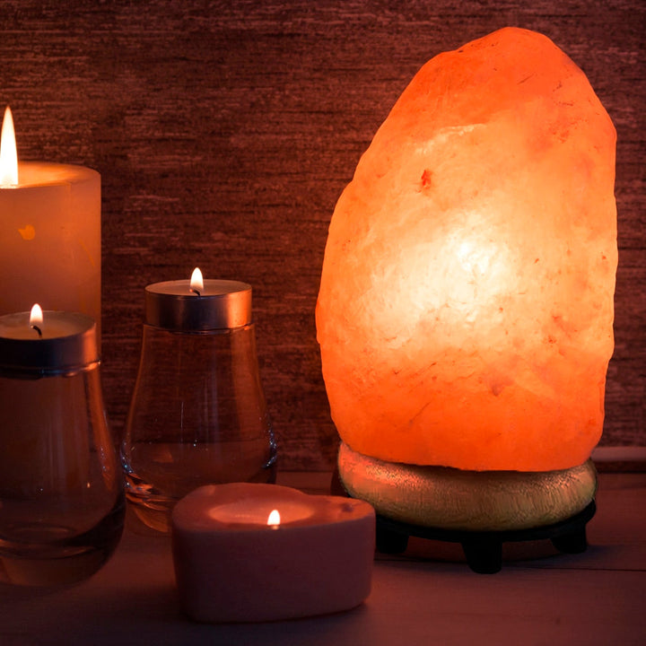 Himalayan salt lamp emitting a warm, soothing pink glow. Natural crystal air purifier for relaxation & home decor.