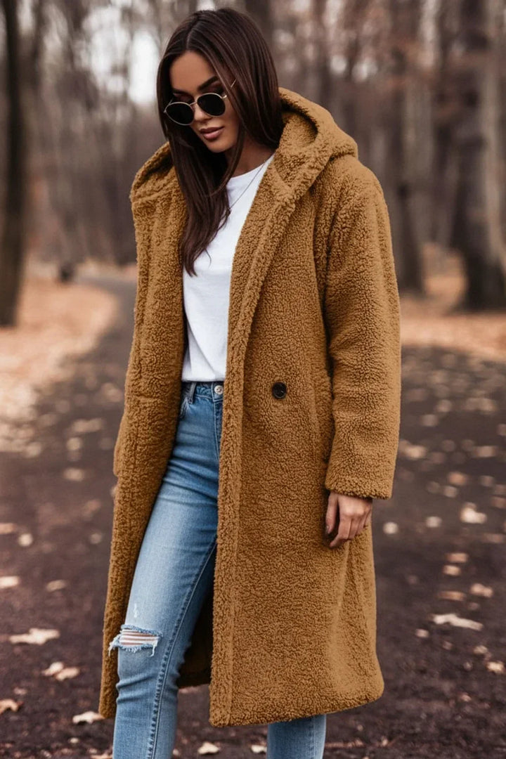 Oversized hooded winter coat for women, providing luxurious warmth and a chic, relaxed fit.