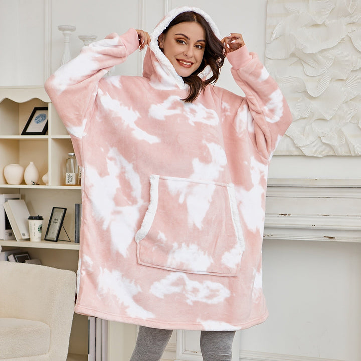 Stay warm in this comfy oversized wearable blanket hoodie with a hood.