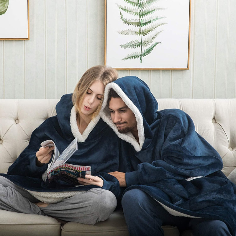 Cozy oversized hoodie blanket with a large front pocket, ideal for chilly days.