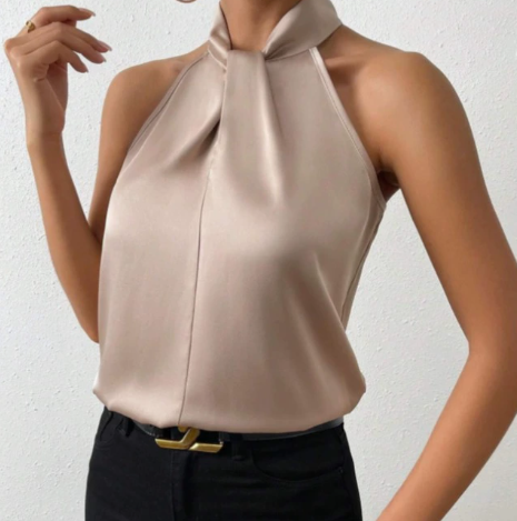 Elegant gold sleeveless blouse with a chic twist-neck design, perfect for evening wear or office fashion.