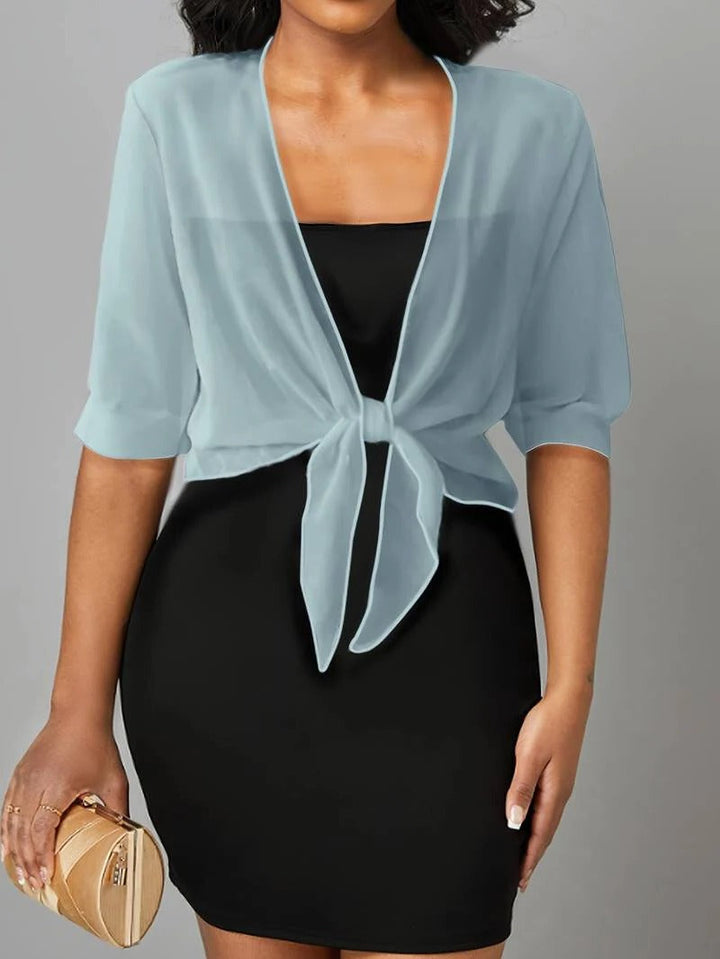 Stylish women's sheer crop top cardigan with a delicate tie front, 3/4 sleeves, and casual vibe.