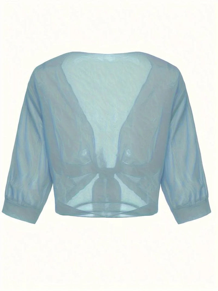Women's sheer crop cardigan with a charming tie front, offering a lightweight and fashionable layer.