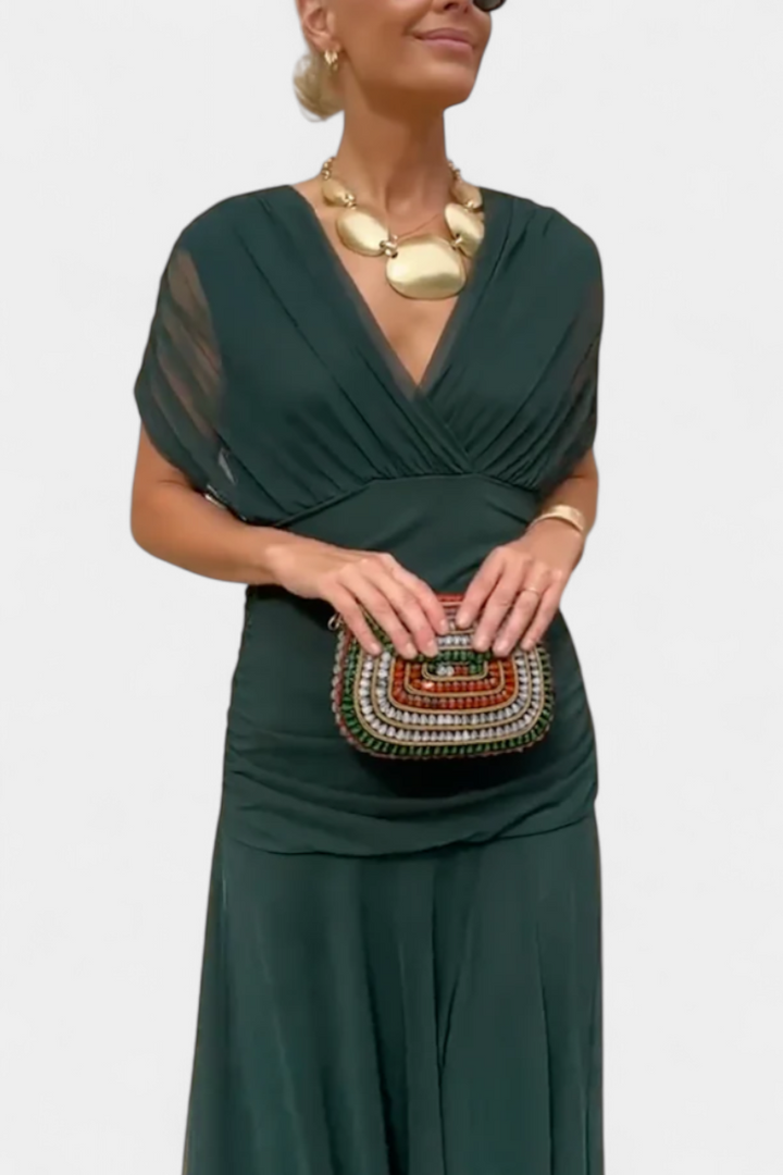 Off-shoulder detail of a graceful floral maxi dress, highlighting the elegant neckline & sleeves.