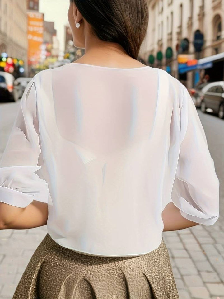 Elegant sheer tie front crop cardigan top for women, providing a lightweight summer layer.