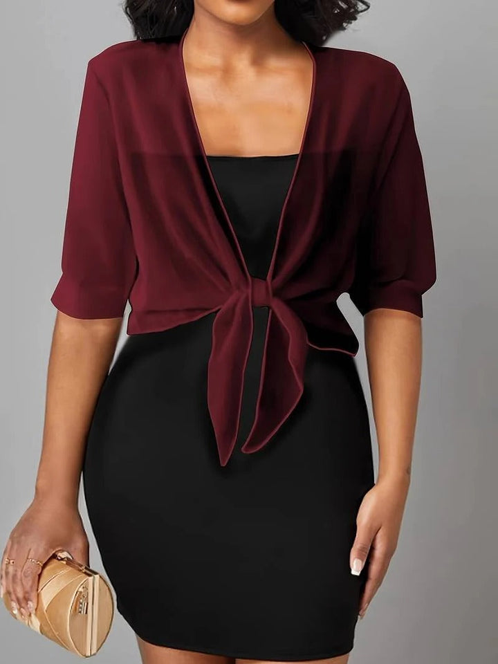 Women's sheer lightweight crop cardigan with tie front, a versatile piece for warm seasons.
