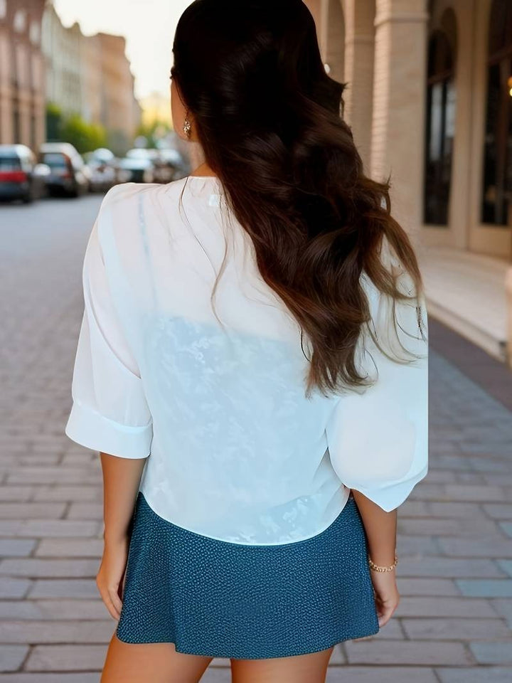 Women's sheer crop cardigan with a functional tie front, 3/4 sleeves, and a breezy feel.
