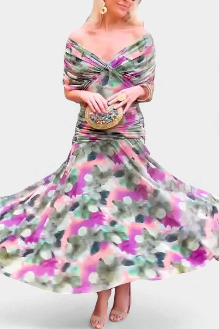 Vibrant purple floral off-shoulder long dress, designed as an elegant and flowing occasion wear gown.