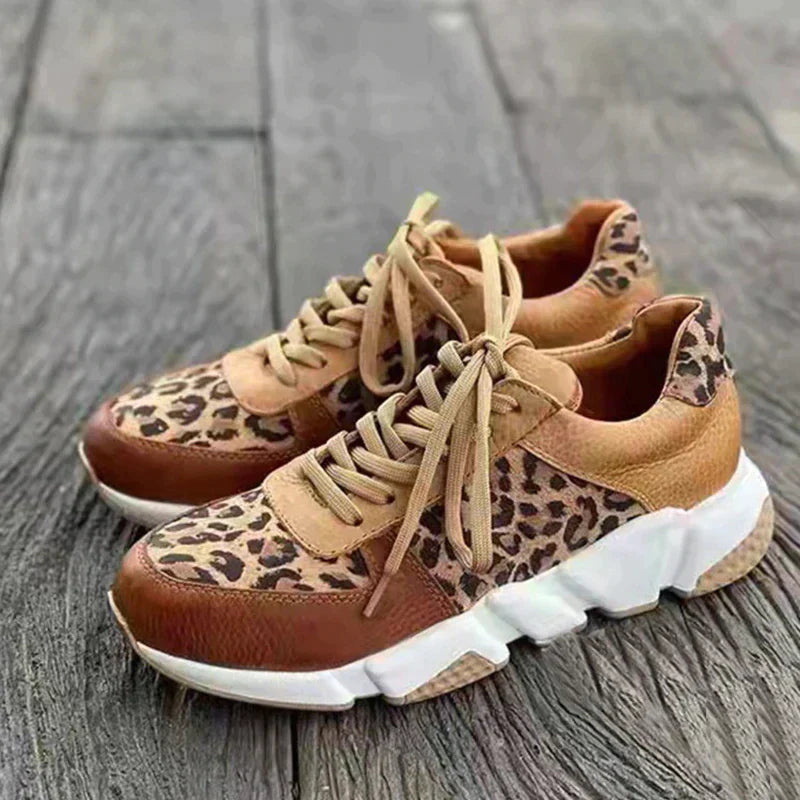 Comfortable women's leopard print athletic style sneakers. Trendy animal print lace-up walking shoes.