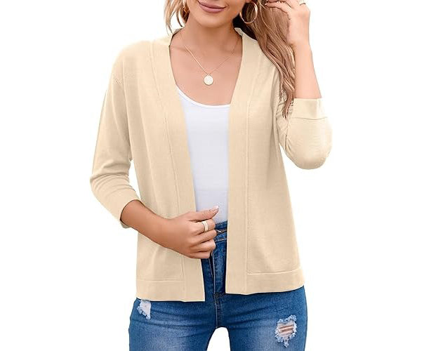 Full shot: Woman in a casual outfit featuring a cozy three-quarter sleeve open-front cardigan sweater.