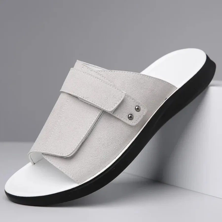 Close-up of men's adjustable strap slides, highlighting the comfortable molded sole for summer casual footwear.