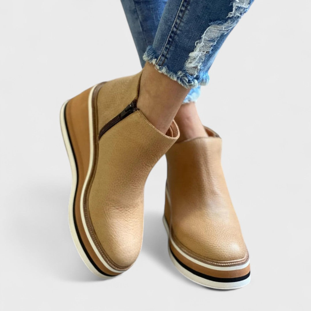 Stylish black women's Chelsea ankle boots, slip-on design, great for fall fashion & versatile everyday wear.