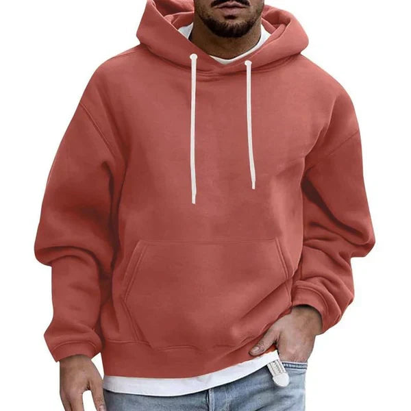 Relaxed fit men's oversized hoodie featuring a large kangaroo pocket, offering both style and comfort.