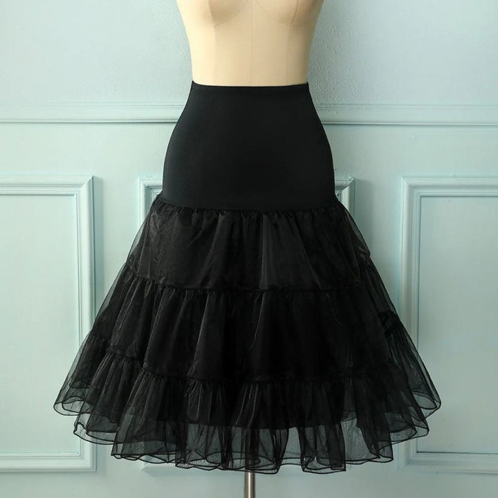 Glamorous women's black layered tutu petticoat underskirt, adding volume to party or costume skirts.