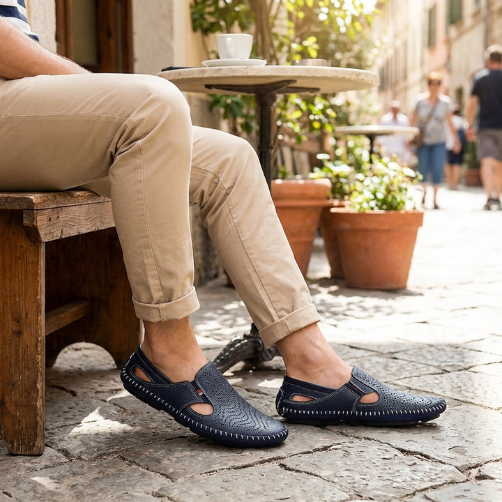 Men's classic perforated slides with woven stitch detail. Casual, comfortable summer footwear.