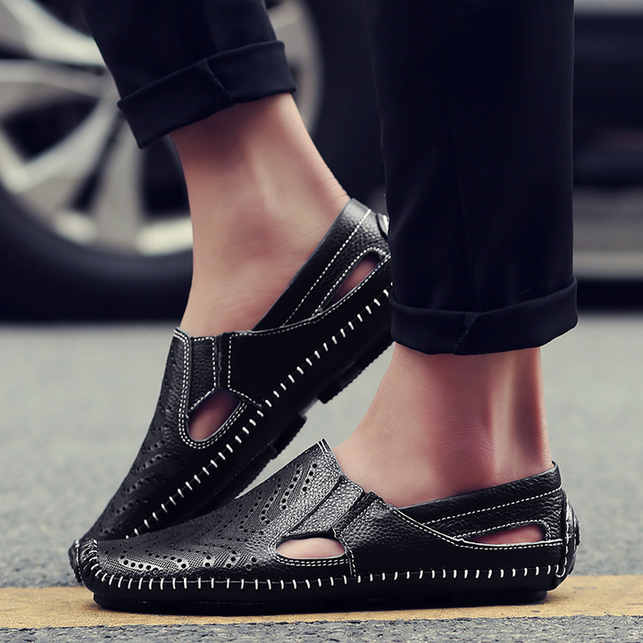 Men's outdoor perforated slides with woven stitch. Durable, comfortable summer footwear for casual adventures.