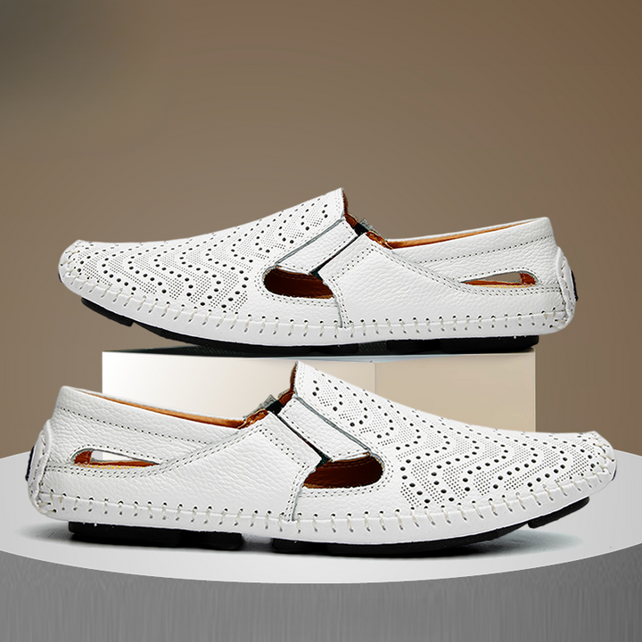 Men's perforated slides with intricate woven stitch detail. Stylish and comfortable casual summer sandals.
