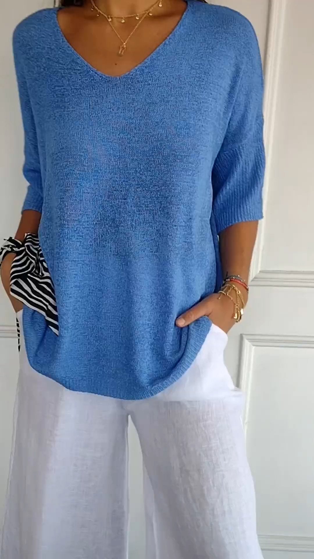 Women's V-neck knit top, a comfy long sleeve shirt in a relaxed fit for versatile elegant style.