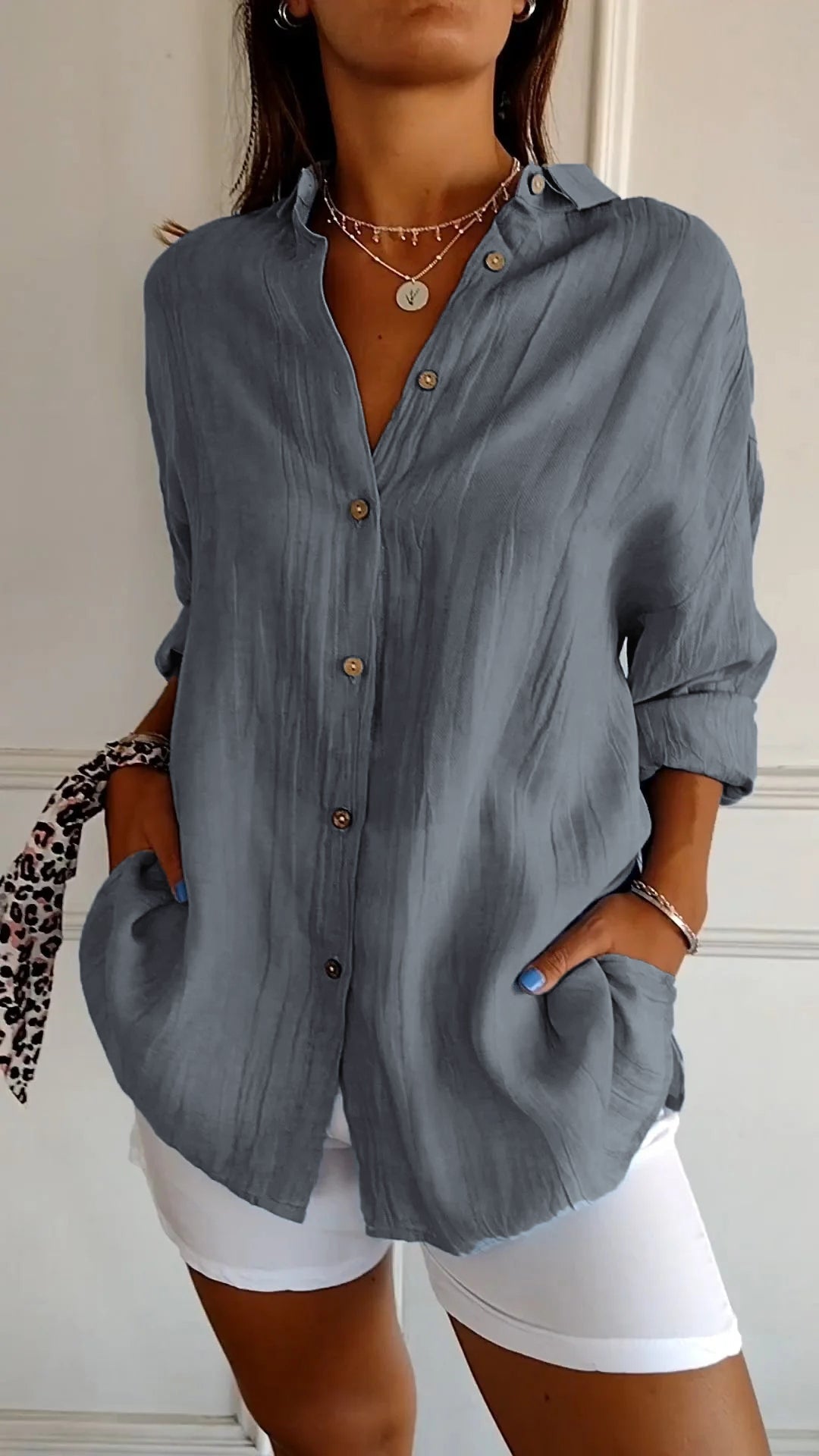 Stylish women's blouse with subtle pleats, ideal for effortless office wear.