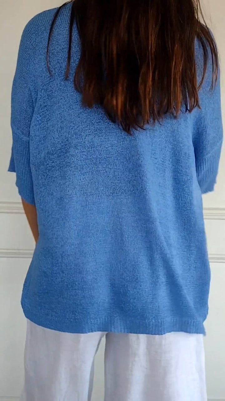 Sophisticated women's V-neck knit top. Effortless long sleeve design for casual or elegant occasions.