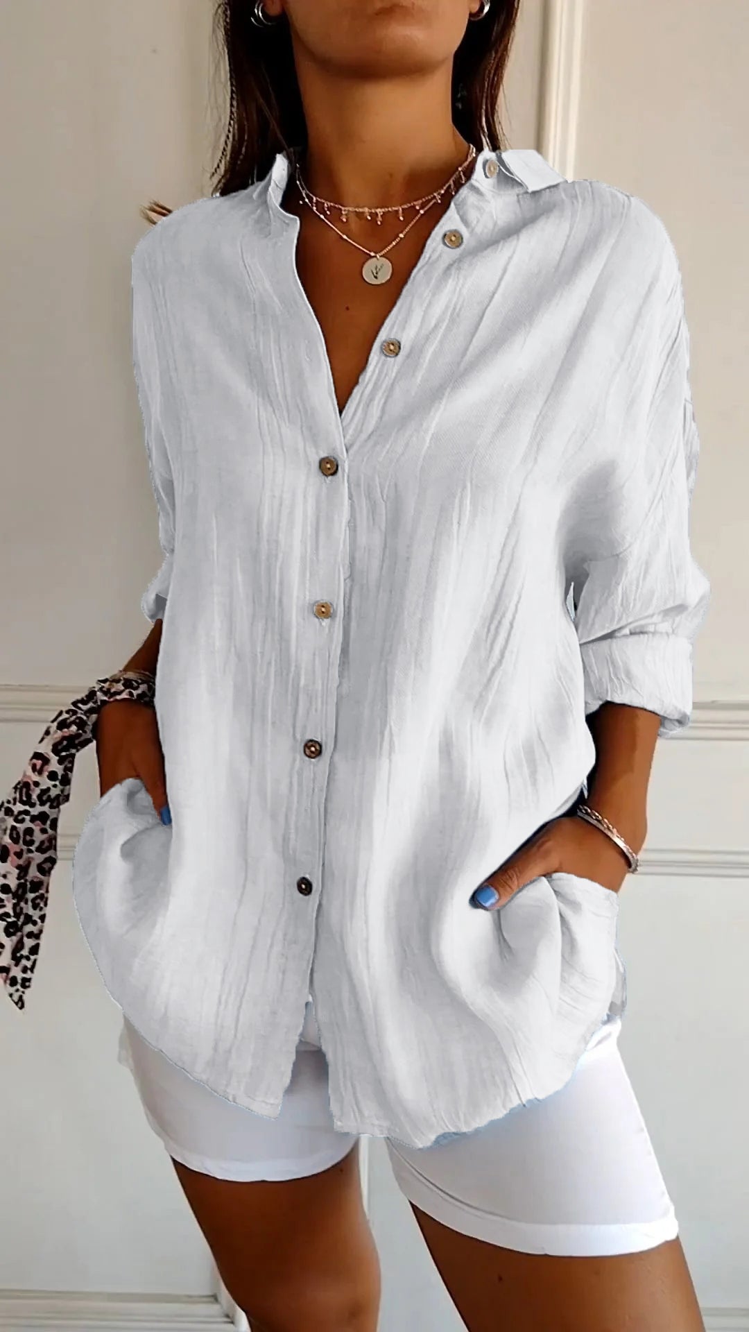 Elegant women's pleated blouse, perfect for office wear or casual chic style.
