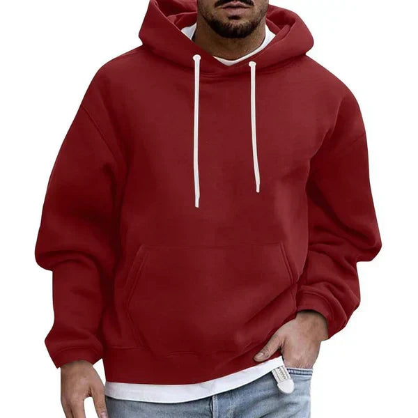 Stylish men's oversized pullover hoodie with kangaroo pocket, ideal for modern streetwear and casual outfits.