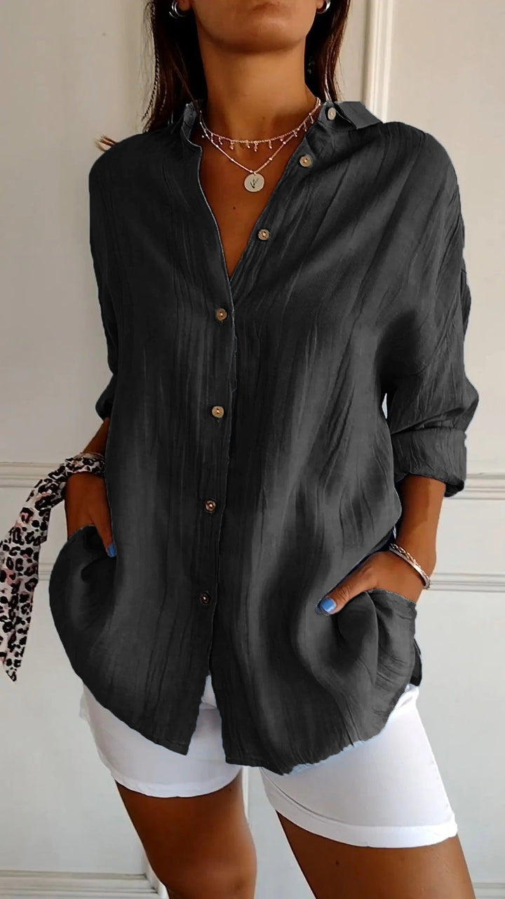 Versatile ladies' pleated top for comfortable, modern spring and summer fashion.