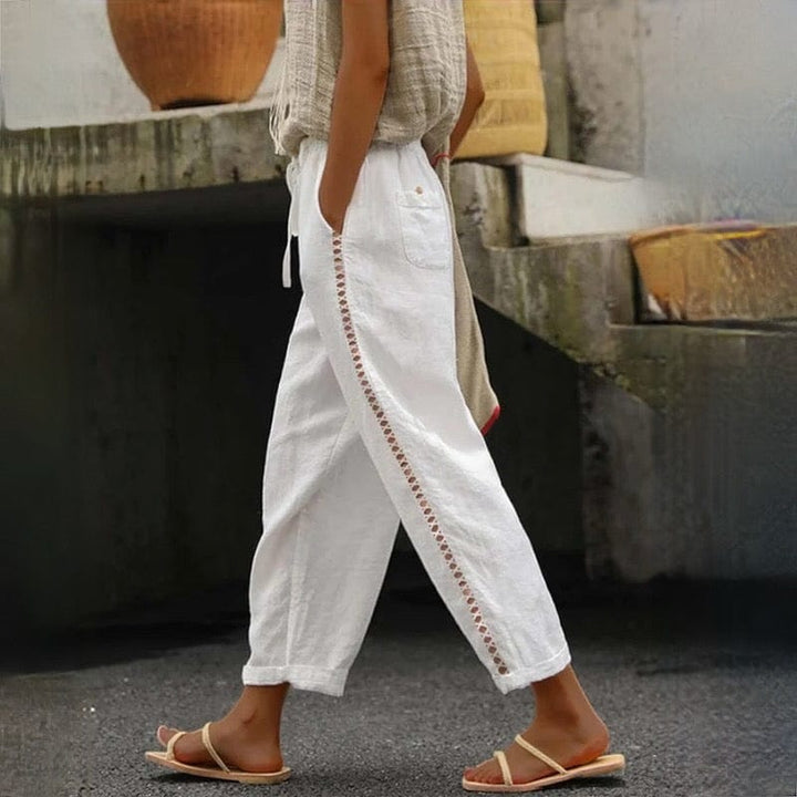 Women's chic linen cropped pants with elastic waist and delicate eyelet trim, perfect for summer casual wear.