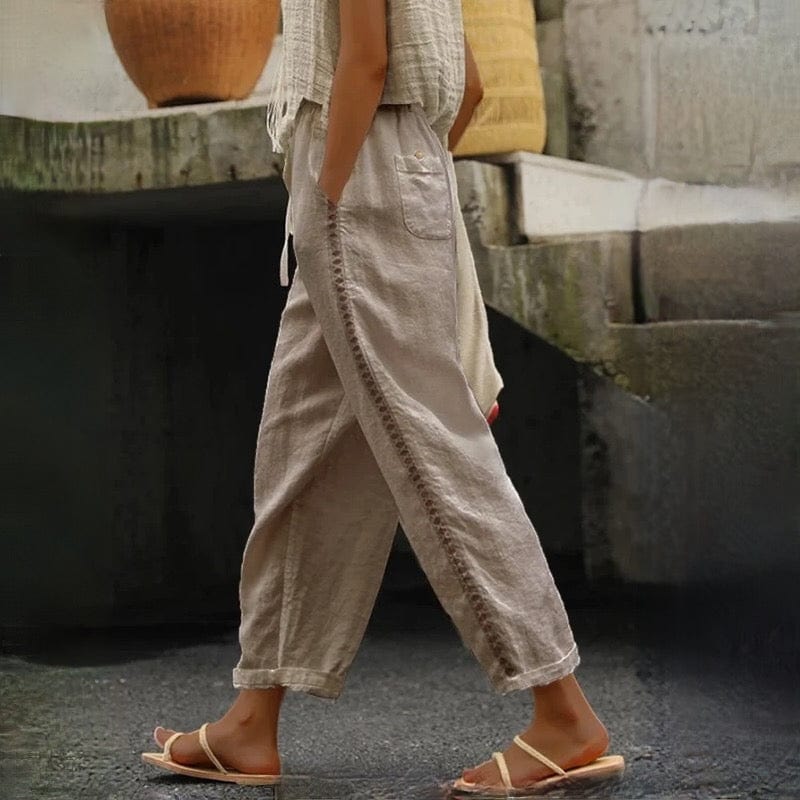 Relaxed fit women's linen cropped pants, designed with a comfortable elastic waist and elegant eyelet detail.