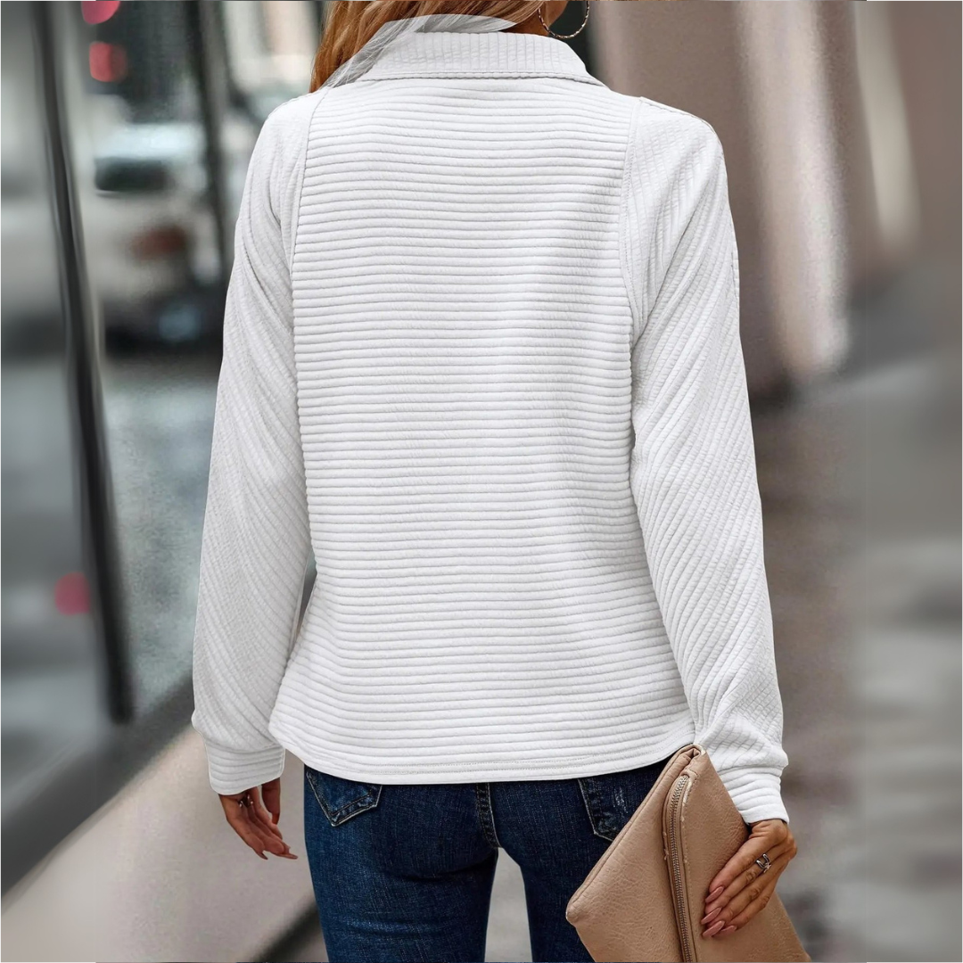 Soft ribbed women's pullover sweater with half-zip closure. Cozy long-sleeve top for comfortable layering & casual style.