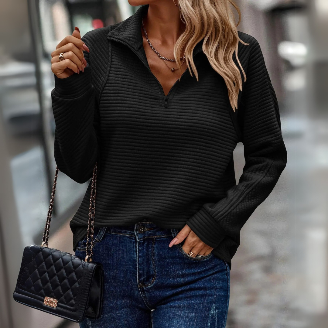 Relaxed fit women's cozy ribbed half-zip pullover sweater. Comfortable long-sleeve top for everyday casual fashion.