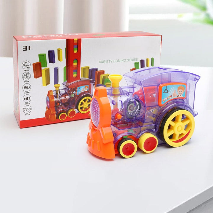 Electric domino train automatically placing vibrant domino building blocks for engaging kids' play.
