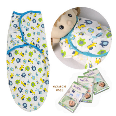 Happy infant looking cozy & secure in an adjustable baby sleep sack. Cotton newborn swaddle.