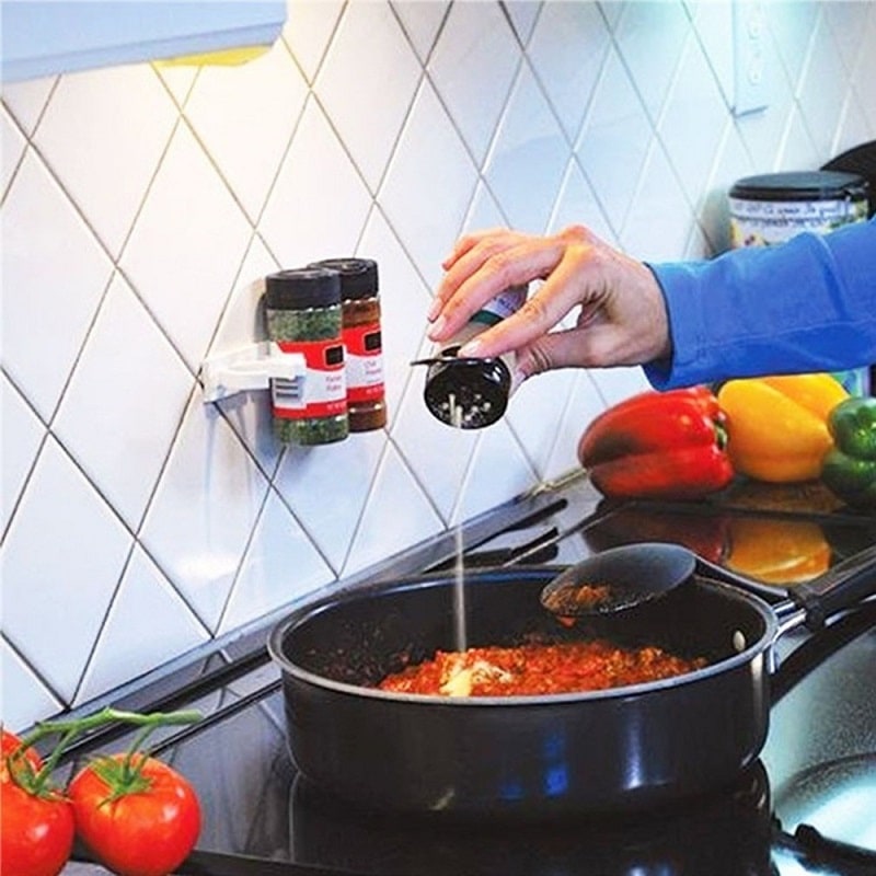 Tidy up your kitchen cabinet! Adhesive spice rack organizer transforms cluttered spice bottles.