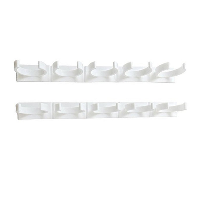 Set of multiple adhesive spice racks mounted on a pantry door for efficient, space-saving kitchen storage.