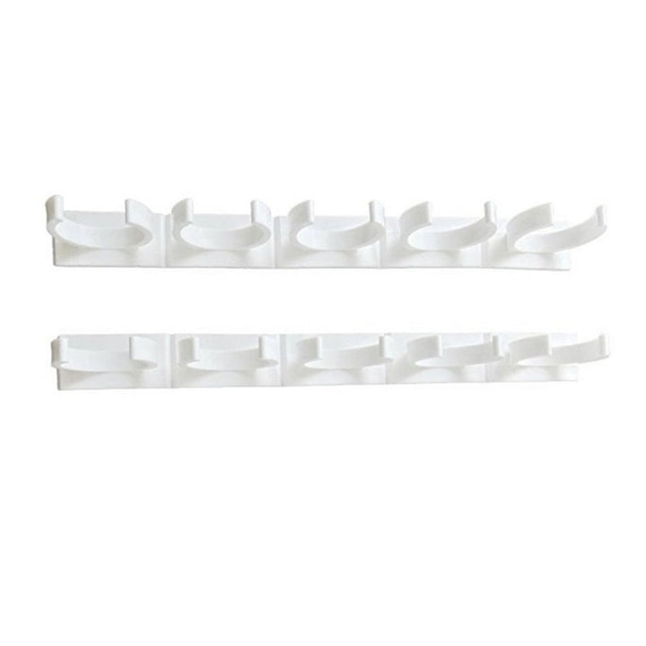 Set of multiple adhesive spice racks mounted on a pantry door for efficient, space-saving kitchen storage.