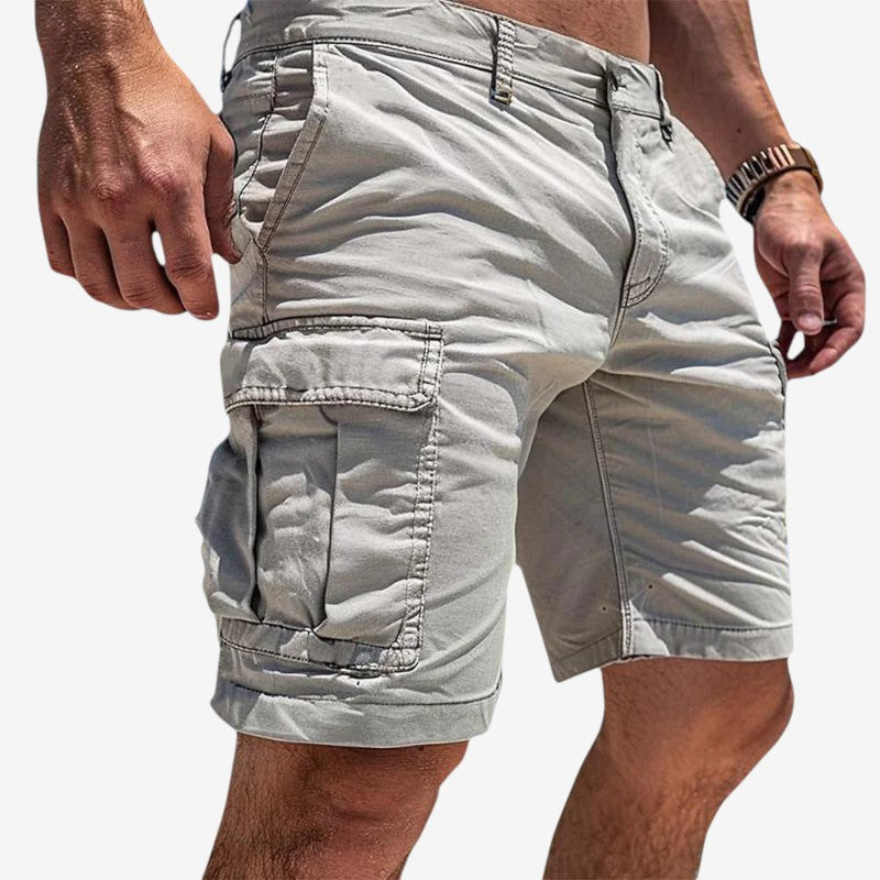 Stylish men's knee-length utility shorts featuring ample multi-pockets, great for fashion & outdoor utility.