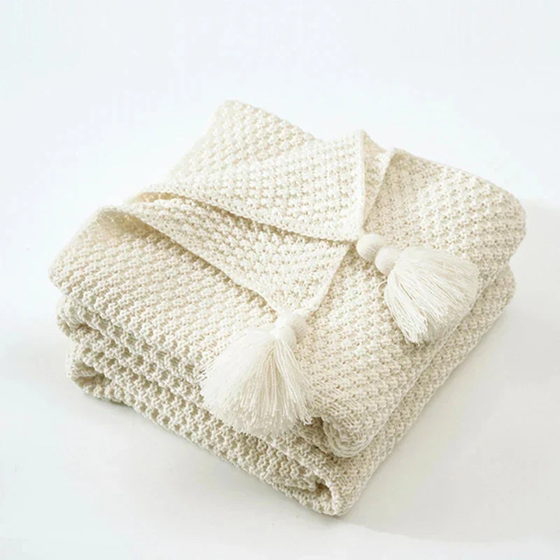 NordicCozy knitted wool throw blanket with tassels, ultra-soft comfort for home decor.