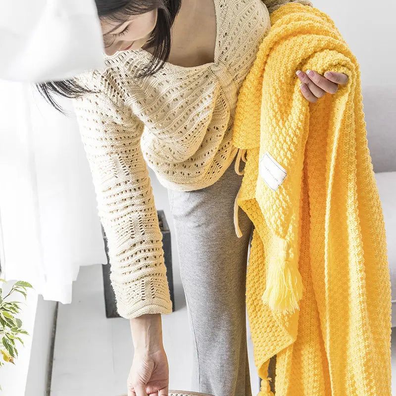 Versatile ultra-soft knitted wool throw blanket with tassels, a cozy gift for any home.