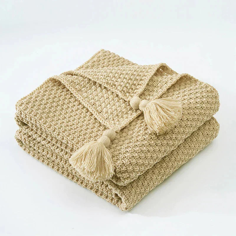 Snuggle up with this ultra-soft knitted wool throw blanket & tassels, bringing comfort to any room.