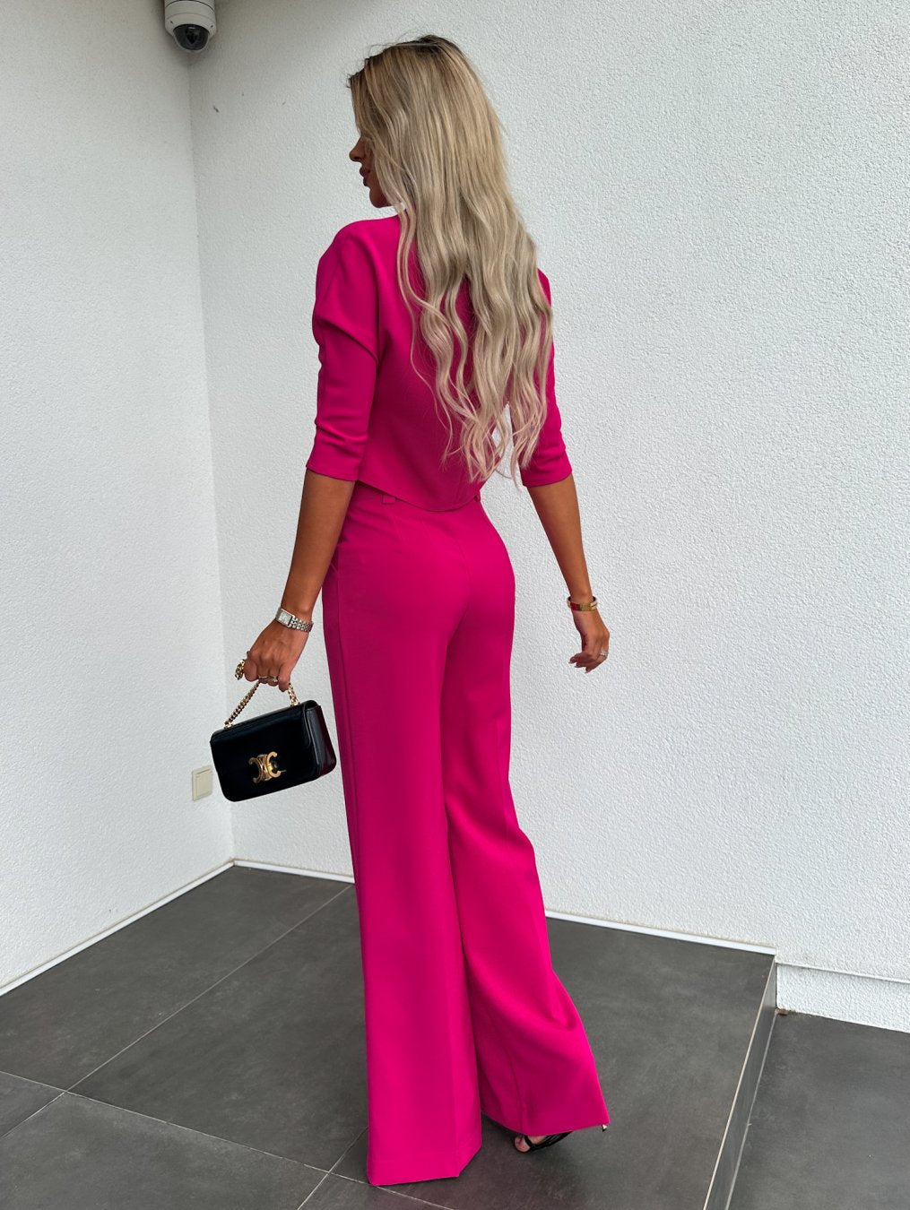 Chic women's two-piece pants & top set. Coordinated for comfort, style, and versatile day-to-night wear.