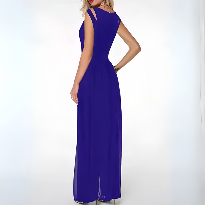 Woman showcasing a black sleeveless party jumpsuit with graceful wide flared legs, ideal for evening wear.