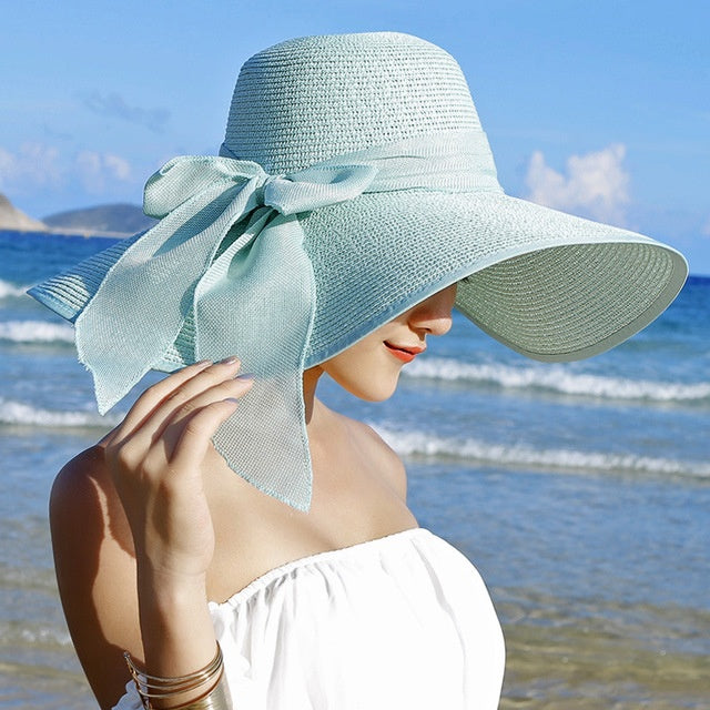 Candy women's straw hat for sun protection. A stylish, breathable, wide-brim beach and vacation essential.