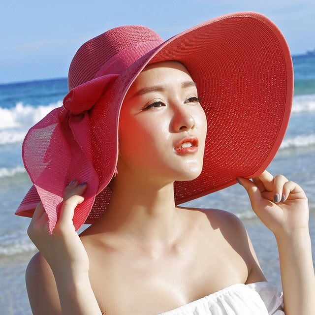 Candy-colored, breathable women's straw hat. Wide brim for sun protection, perfect for beach & summer fashion.