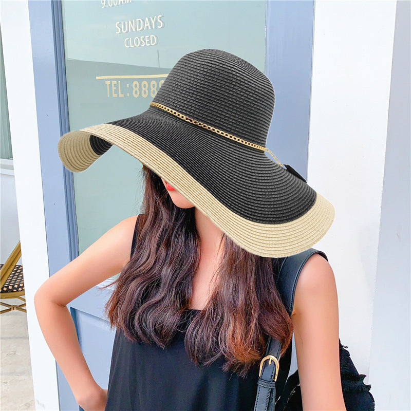 Elegant women's wide brim sun hat offering UV protection. Ideal travel accessory for beach, garden, & summer.