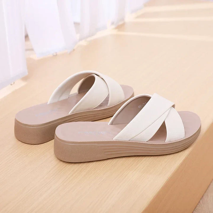 Comfortable ladies' open-toe wedge sandals. Perfect summer footwear with a supportive wedge heel.