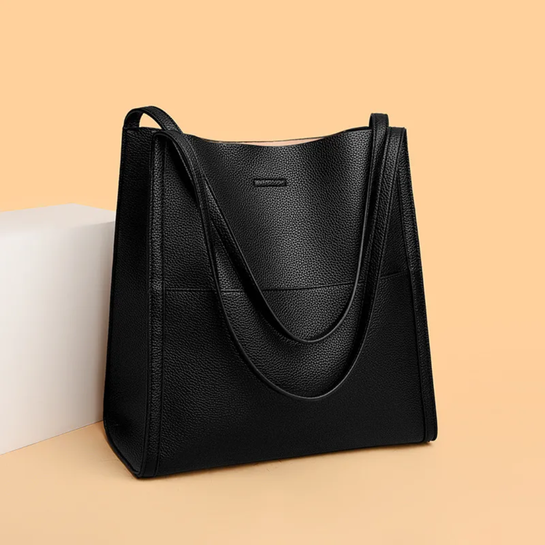 Fashionable women's spacious leather handbag. Large capacity, sturdy everyday bag in various colors.